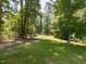 Secluded backyard surrounded by mature trees, offering a peaceful and natural setting at 2609 Kilmartin Dr, Fuquay Varina, NC 27526