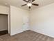 Bedroom with carpeted floors, ceiling fan, and access to a closet at 2609 Kilmartin Dr, Fuquay Varina, NC 27526