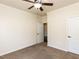 Bedroom with carpeted floors, ceiling fan, and access to a bathroom at 2609 Kilmartin Dr, Fuquay Varina, NC 27526