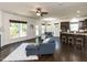 Spacious living area with hardwood floors, a cozy fireplace, and an open layout connecting the kitchen and dining at 2609 Kilmartin Dr, Fuquay Varina, NC 27526