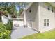 The cozy back patio features white-trimmed french doors, a table, and a covered grill at 3012 Optimist Farm Rd, Apex, NC 27539