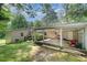 Spacious backyard with a covered patio, ideal for entertaining and outdoor activities at 3012 Optimist Farm Rd, Apex, NC 27539