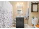 A bathroom is decorated with a sink, mirror, and towel rack at 3012 Optimist Farm Rd, Apex, NC 27539