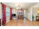 An intimate dining area showcases a modern table set and a stylish china cabinet at 3012 Optimist Farm Rd, Apex, NC 27539