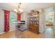 An intimate dining area showcases a modern table set and a stylish china cabinet at 3012 Optimist Farm Rd, Apex, NC 27539