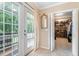 Inviting entryway with french door and a walk-in closet, bathed in soft natural light at 3012 Optimist Farm Rd, Apex, NC 27539