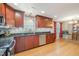 A modern kitchen boasts stainless steel appliances, granite countertops, and ample cabinet space at 3012 Optimist Farm Rd, Apex, NC 27539