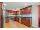 This kitchen features cherry wood cabinets, granite countertops, stainless steel appliances at 3012 Optimist Farm Rd, Apex, NC 27539