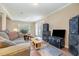 Living room with hardwood floors, an open layout, and a ceiling fan at 3012 Optimist Farm Rd, Apex, NC 27539