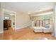 Relaxing living room space with hardwood floors and comfortable seating area near the staircase at 3012 Optimist Farm Rd, Apex, NC 27539