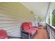 Relax on the porch with comfortable seating, perfect for enjoying the outdoors at 3012 Optimist Farm Rd, Apex, NC 27539
