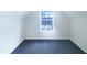 An empty room with a window showing a glimpse of the outside at 308 Quartz Dr, Durham, NC 27703