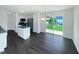 Bright kitchen featuring stainless steel appliances, a center island, and sliding glass doors to the outside at 308 Quartz Dr, Durham, NC 27703