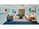 Bright living room with stylish furniture, a ceiling fan, and a bookshelf that enhances the room's appeal at 308 Quartz Dr, Durham, NC 27703