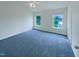 Spacious main bedroom with windows to let in natural light and a ceiling fan at 308 Quartz Dr, Durham, NC 27703