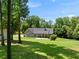 View of back of home showing large patio at 311 Rassie Crabtree Rd, Rougemont, NC 27572