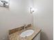Bathroom vanity featuring granite countertops and modern fixtures at 311 Rassie Crabtree Rd, Rougemont, NC 27572