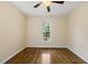 Bright bedroom with hardwood floors, a ceiling fan, and a window providing natural light at 311 Rassie Crabtree Rd, Rougemont, NC 27572