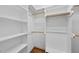 Spacious walk-in closet with built-in shelving at 311 Rassie Crabtree Rd, Rougemont, NC 27572