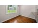 Dining area features a large window overlooking the yard and wood flooring at 311 Rassie Crabtree Rd, Rougemont, NC 27572