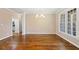 Dining room features hardwood floors, natural light and a chandelier at 311 Rassie Crabtree Rd, Rougemont, NC 27572