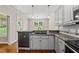 Updated kitchen features granite countertops and stainless steel appliances at 311 Rassie Crabtree Rd, Rougemont, NC 27572