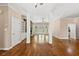 Open living room with hardwood floors and natural light at 311 Rassie Crabtree Rd, Rougemont, NC 27572