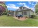 Spacious backyard with patio, outdoor seating, and beautiful landscaping with view of the house at 3111 Virginia Pine Ln, Apex, NC 27539