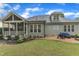 Charming backyard featuring a screened porch, patio, and landscaped yard with lush greenery and outdoor seating area at 3111 Virginia Pine Ln, Apex, NC 27539