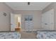 Shared bedroom features twin beds, a dresser with nautical decor, and access to a bathroom at 3111 Virginia Pine Ln, Apex, NC 27539