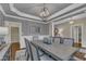 Elegant dining room with hardwood floors, modern light fixture, and wainscoting at 3111 Virginia Pine Ln, Apex, NC 27539