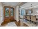 Elegant dining room with hardwood floors, modern light fixture, and wainscoting at 3111 Virginia Pine Ln, Apex, NC 27539
