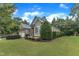 Charming home featuring lush landscaping, with a two-car garage at 3111 Virginia Pine Ln, Apex, NC 27539