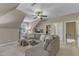 A spacious living room with a large sectional and access to multiple doorways at 3111 Virginia Pine Ln, Apex, NC 27539