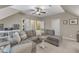 A large living room showcases a sectional sofa, multiple doorways, and custom built-in shelving at 3111 Virginia Pine Ln, Apex, NC 27539
