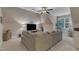 Spacious and cozy living room with vaulted ceilings, a large sectional, and ample natural light at 3111 Virginia Pine Ln, Apex, NC 27539