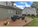 Inviting backyard patio with comfortable seating and lush lawn. Perfect for outdoor relaxation and entertaining at 3111 Virginia Pine Ln, Apex, NC 27539