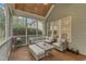 Relaxing screened porch features comfortable seating, ceiling fan, and view to back yard at 3111 Virginia Pine Ln, Apex, NC 27539