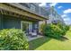 Cozy patio with outdoor seating overlooking a well maintained lawn and lush landscaping at 336 Skymont Dr, Holly Springs, NC 27540