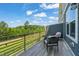Scenic balcony with outdoor seating, perfect for enjoying the wooded view and fresh air at 336 Skymont Dr, Holly Springs, NC 27540