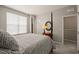 Bedroom with carpet and natural light with views of the wooded area through the large windows at 336 Skymont Dr, Holly Springs, NC 27540