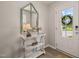 Charming entryway featuring a decorative mirror, a stylish console table, and a welcoming ambiance at 336 Skymont Dr, Holly Springs, NC 27540