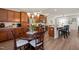 Open-concept kitchen with wood cabinets, granite countertops, and a view into the adjacent living spaces at 336 Skymont Dr, Holly Springs, NC 27540