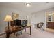 Inviting office space with two monitors, a comfortable chair, and plenty of natural light at 336 Skymont Dr, Holly Springs, NC 27540