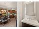 Well lit half bathroom with modern finishes and a large mirror at 336 Skymont Dr, Holly Springs, NC 27540