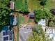Aerial view of the backyard featuring a patio with seating, shed, and green lawn at 425 Morrison Ave, Raleigh, NC 27608