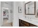 Bright bathroom with a modern vanity, white countertop, and tasteful artwork at 425 Morrison Ave, Raleigh, NC 27608