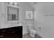 Bright bathroom featuring a dark vanity with light countertop and neutral walls at 425 Morrison Ave, Raleigh, NC 27608