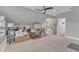 Spacious bonus room with neutral walls and carpeting plus a staircase at 425 Morrison Ave, Raleigh, NC 27608