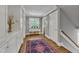 Upstairs hallway featuring hardwood floors, a window and cabinets at 425 Morrison Ave, Raleigh, NC 27608